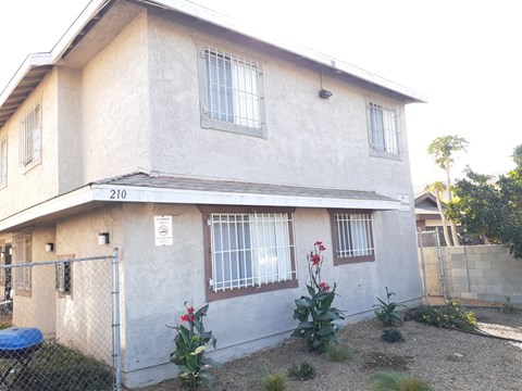 A house with the number 210 on the front.