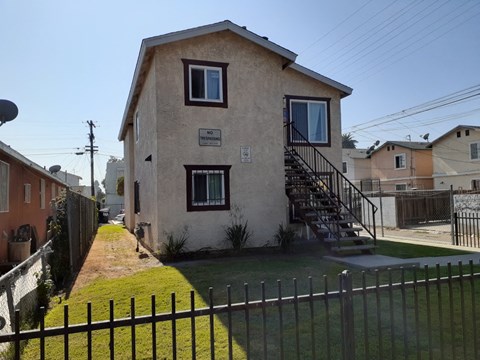A house with a sign that says "NO PARKING" on the front.