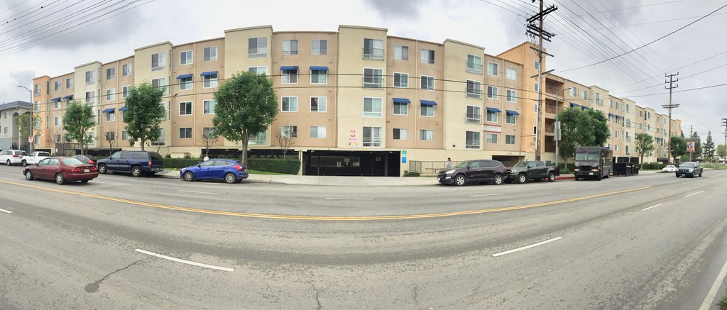 a large building on the corner of a city street