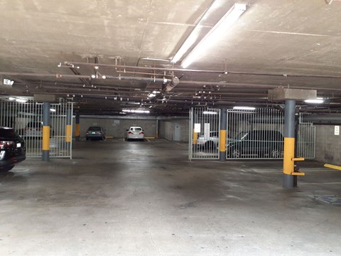 the inside of a parking garage with cars