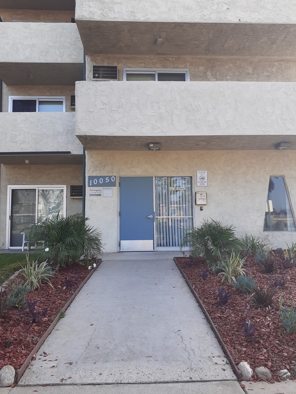 the entrance to a building with a blue door