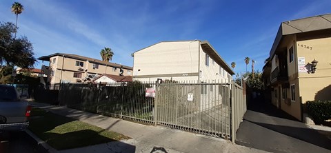 A house with a fence in front of it.
