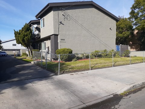 A grey building with the number 6925 on it.