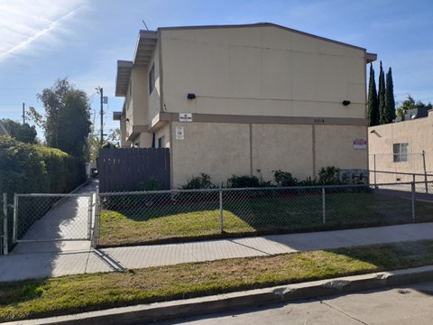 A building with a fence in front of it.
