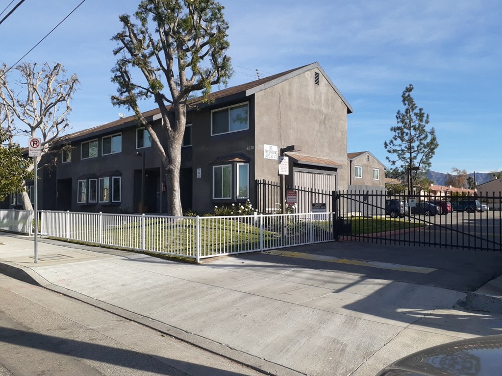 a house with a fence in front of it