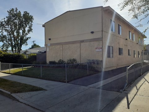 A building with a fence in front of it.