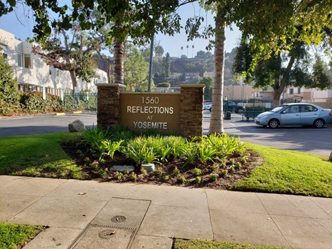 a sign for the reservations on the side of a street
