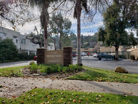 a sign at the entrance of a parking lot