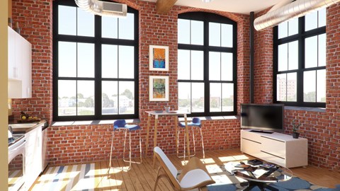 A living room with a brick wall and a television.