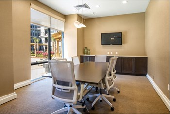 Business center with conference table with chairs and TV & printer. - Photo Gallery 21
