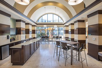 Clubhouse Cafe with seating area. Granite counter top area holds kitchen sink. - Photo Gallery 16