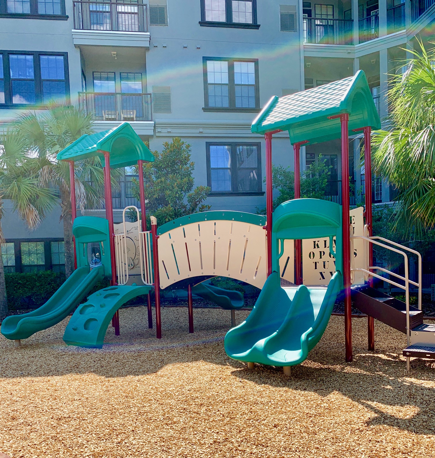Toddler playground with 4 slides and agility half tunnel at The Bartram Apartments in Gainesville, FL 32608