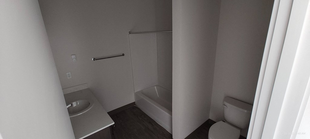 a bathroom with a toilet sink and bathtub