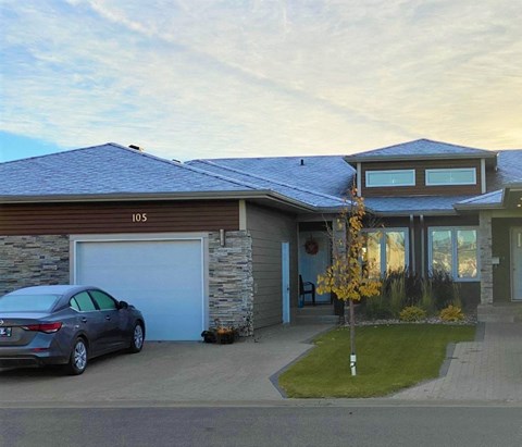 a house with a car parked in front of it