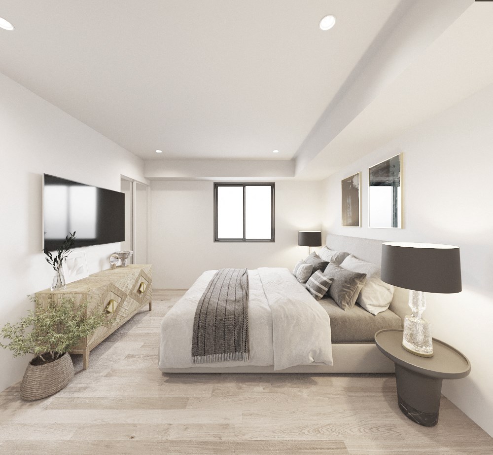 the master bedroom has a large bed and a tv on the wall