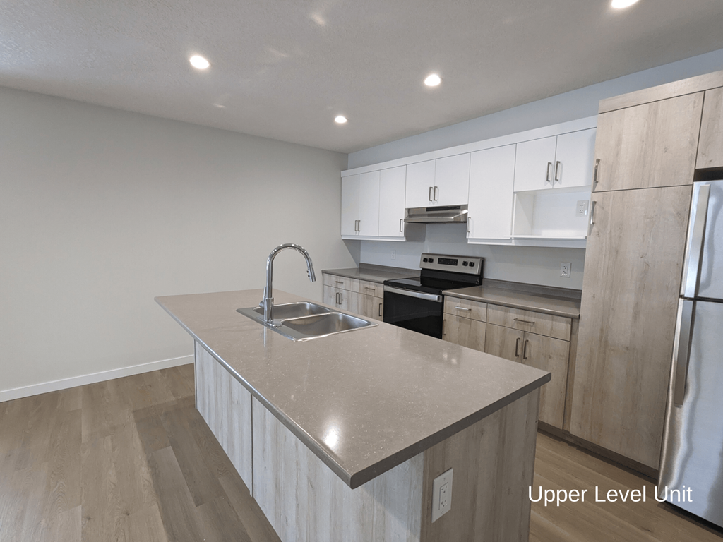 a kitchen with a large counter top and a sink