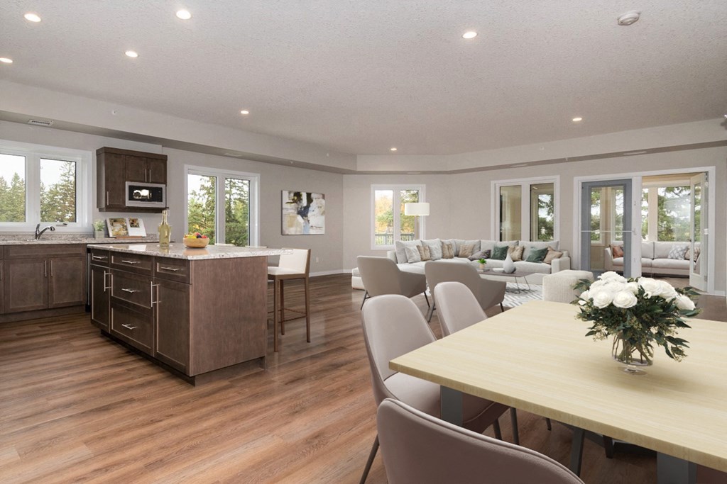 a kitchen and dining room with a table and chairs