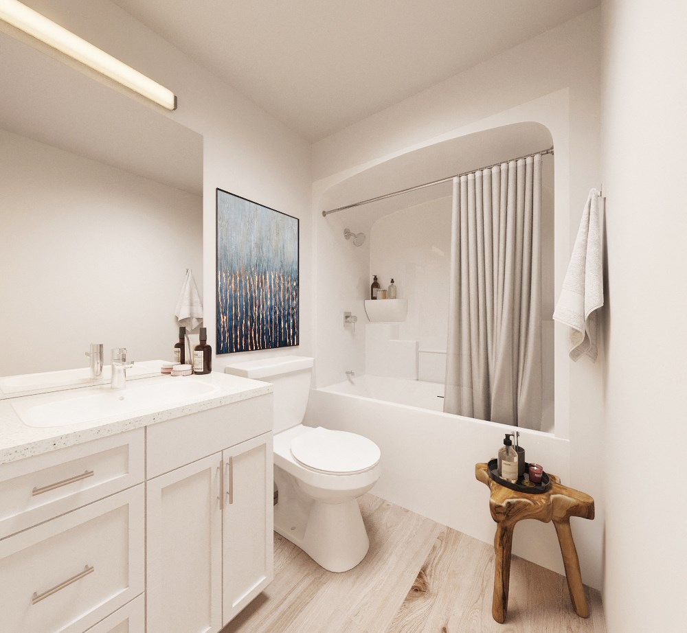 a white bathroom with a toilet and a sink