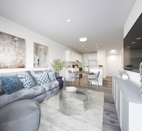 a living room with a couch and a glass table