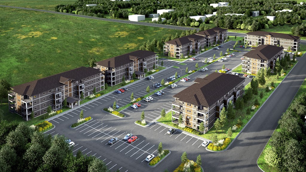 an aerial view of the buildings and parking lot