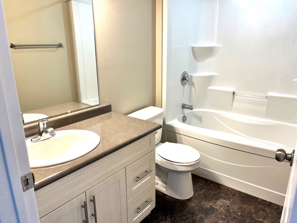 a bathroom with a sink toilet and a bath tub