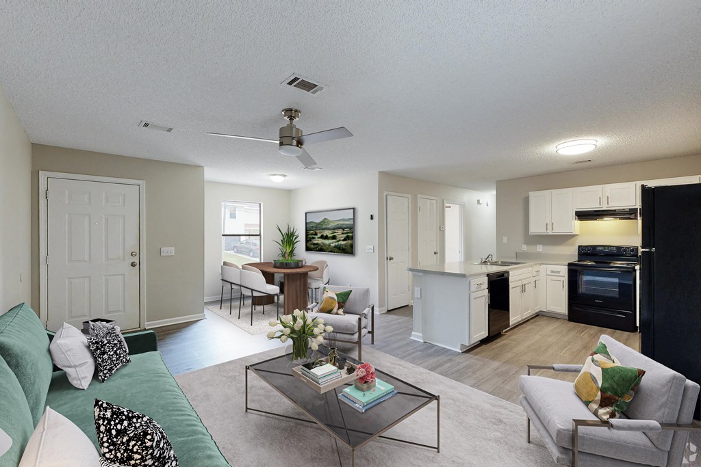 our apartments offer a living room with a couch a coffee table and a kitchen with an island