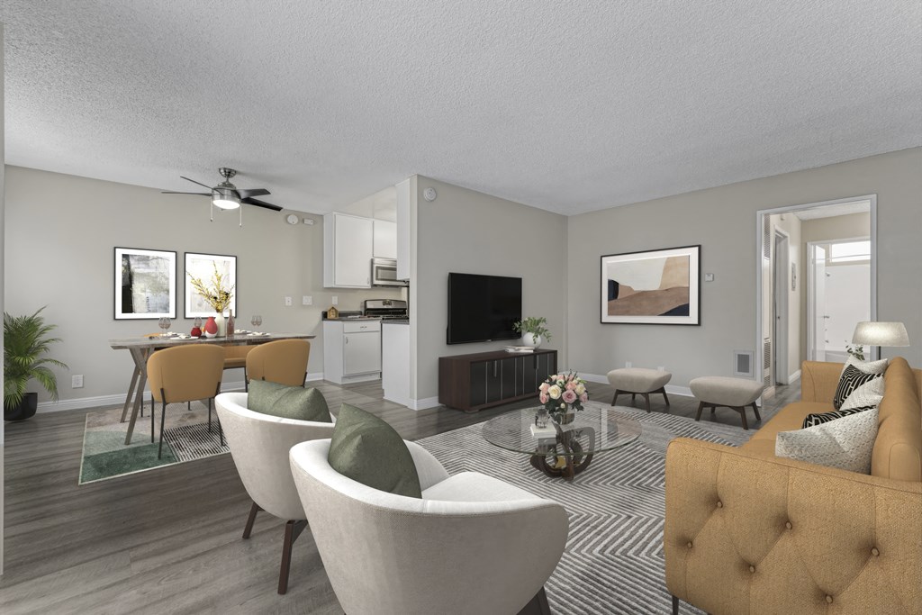 a living room and dining room with couches and chairs