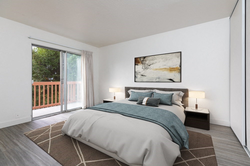 a bedroom with a bed and a sliding glass door