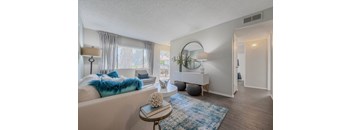 a living room with a couch and a table