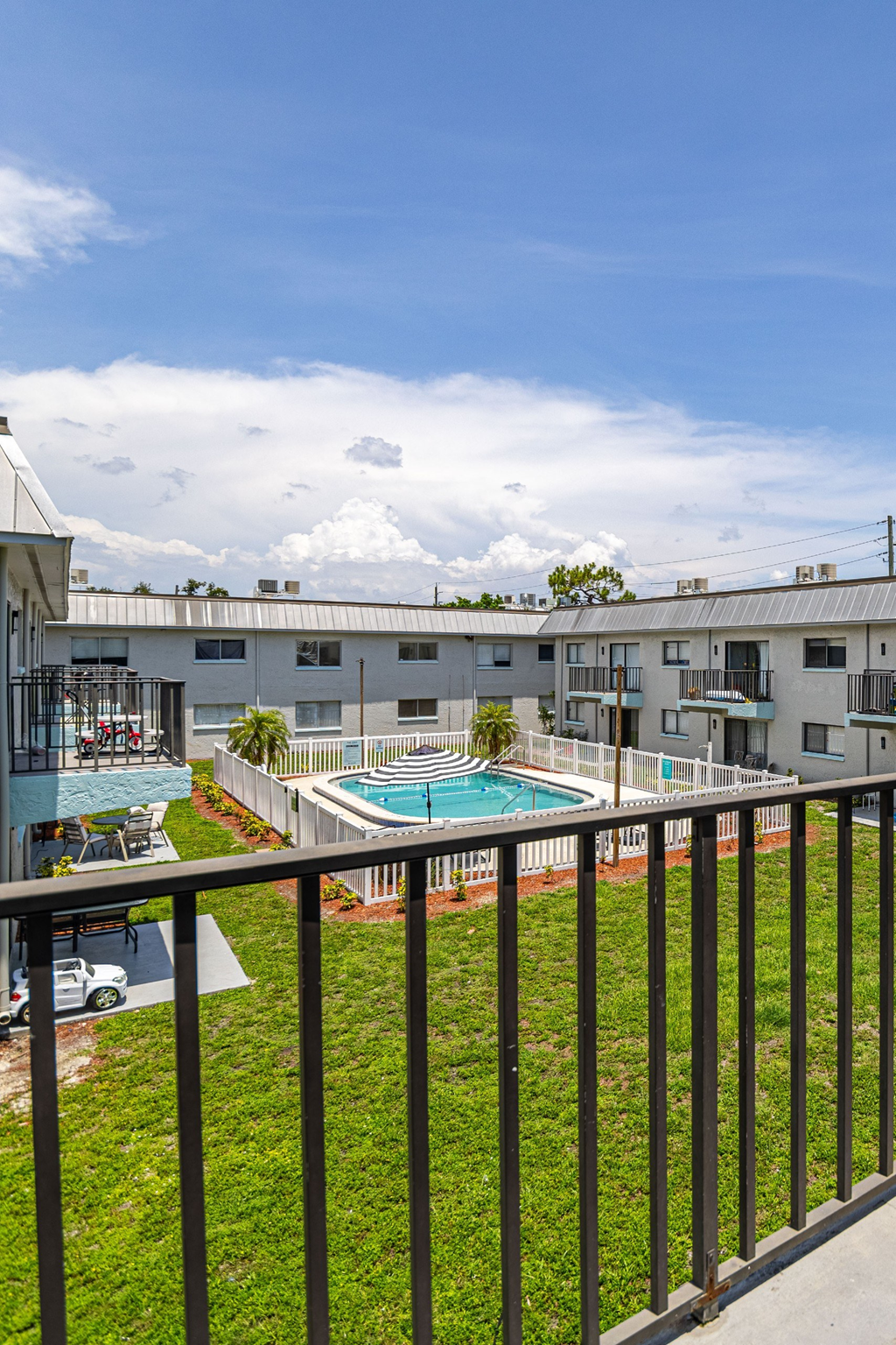 a view of the pool from the balcony at the enclave at woodbridge apartments in sugar land