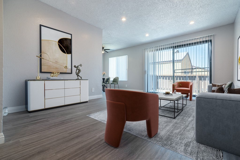 a living room with a couch and chairs and a table