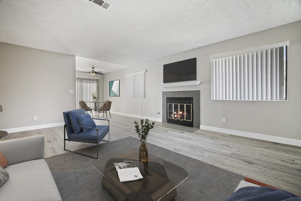 Living room with a fireplace and a television.