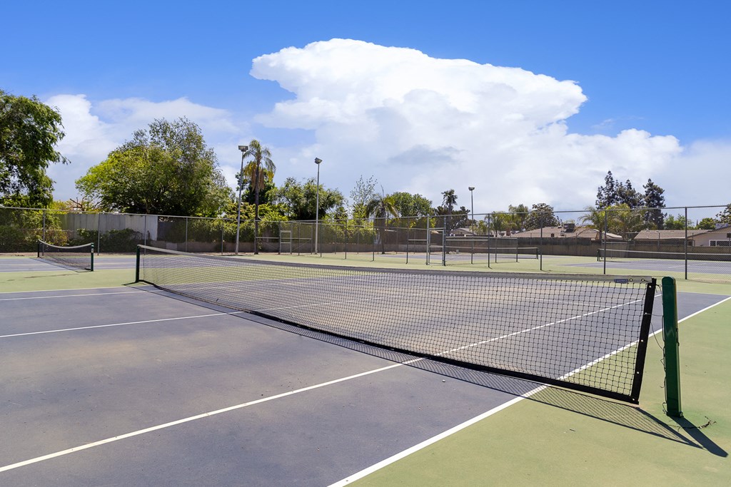 enjoy a game of tennis on the court at camelback resort