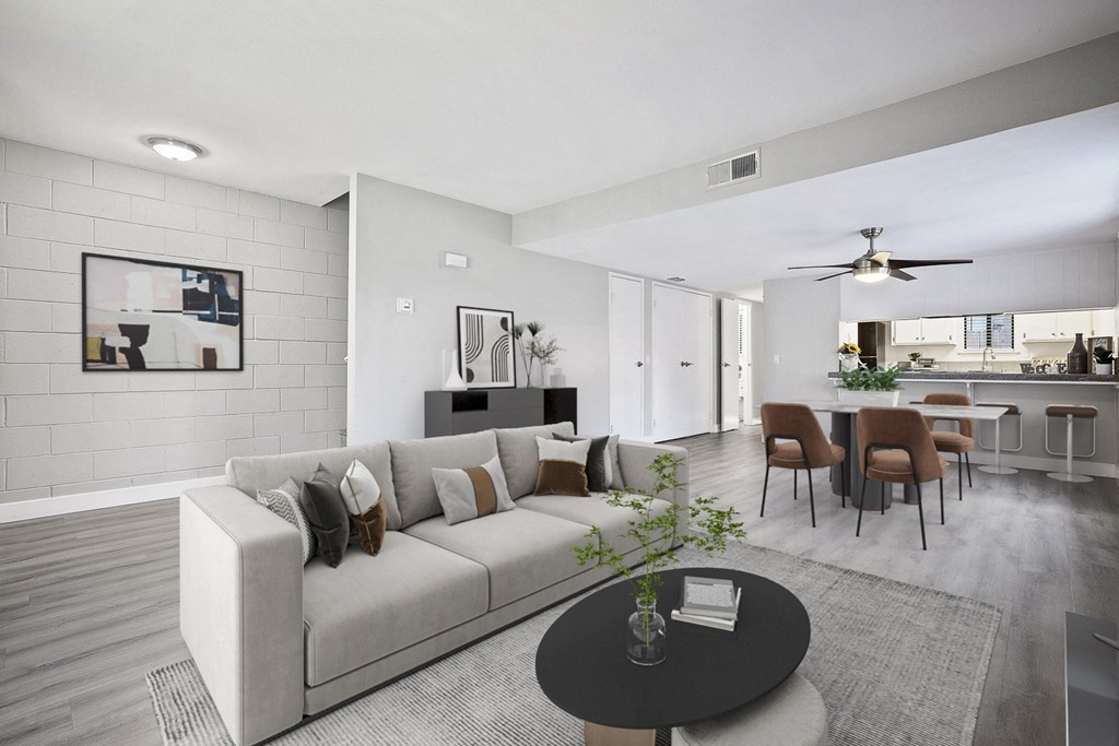 a living room and dining room with a couch and a table