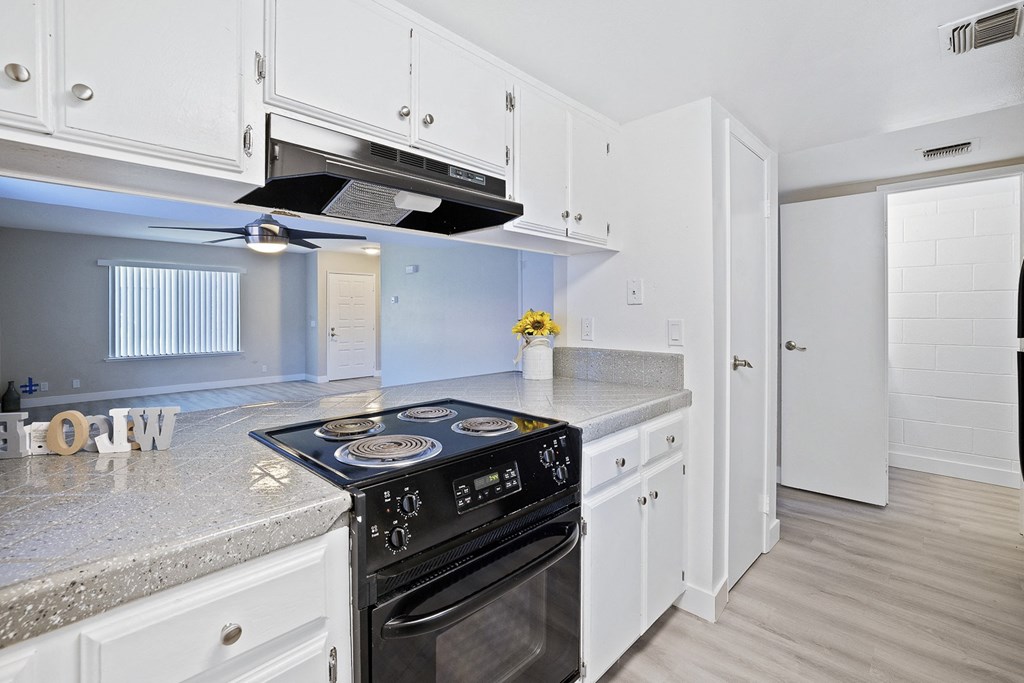 the preserve at ballantyne commons apartment kitchen with stainless steel appliances and white cabinets