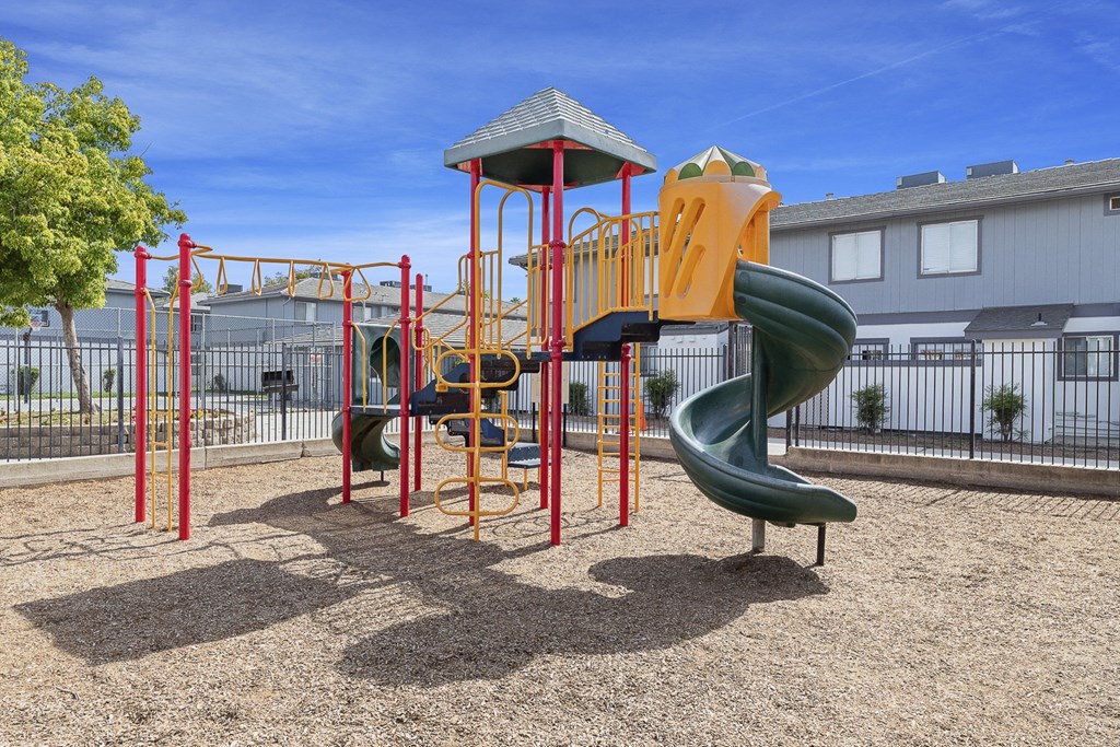 a playground with a slide and monkey bars