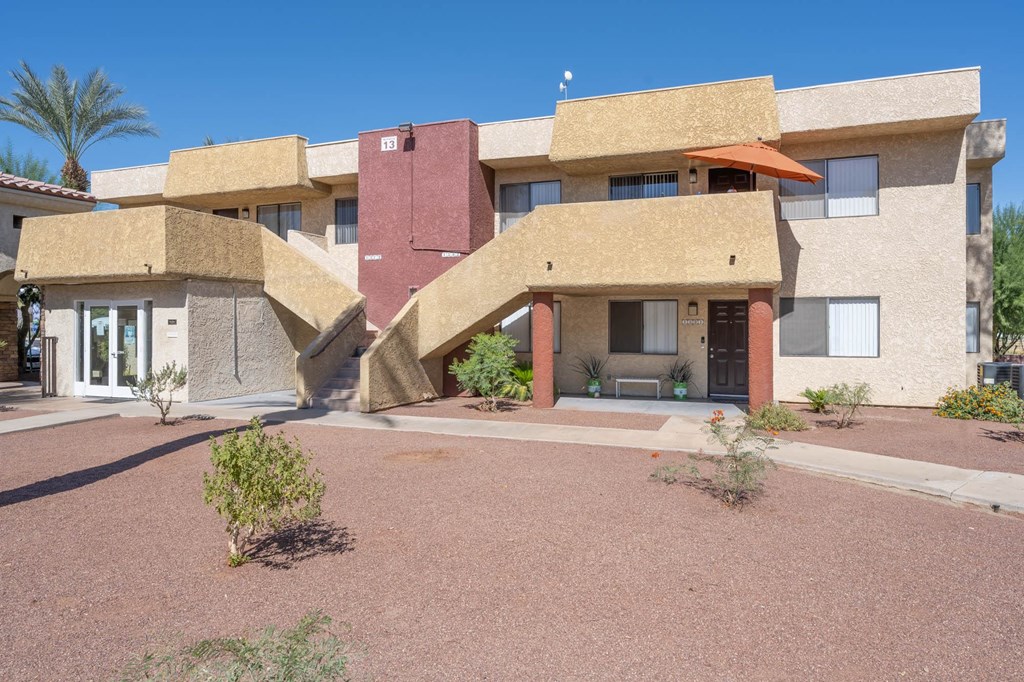 a large house with a courtyard in front of it