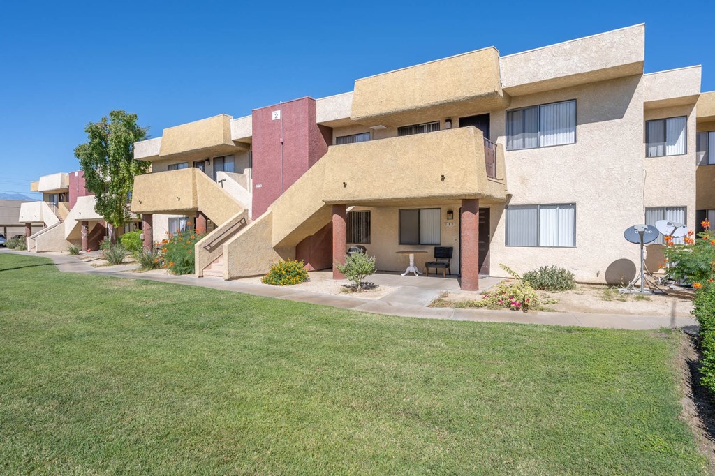 a building with a green lawn in front of it