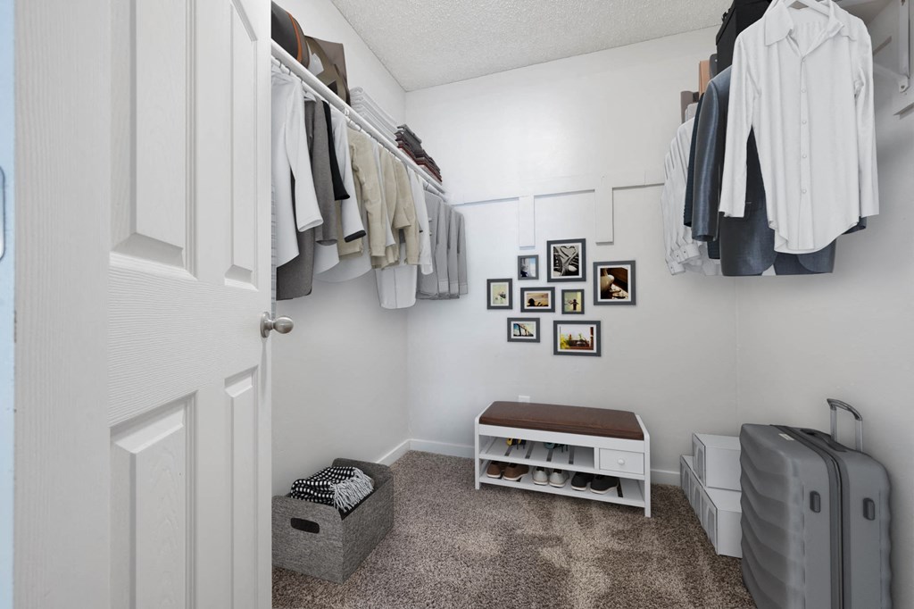 A small room with a bench and a suitcase.