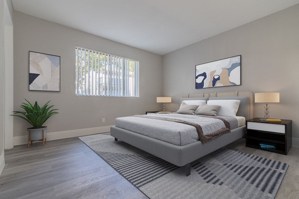 a bedroom with a bed and a rug and a window