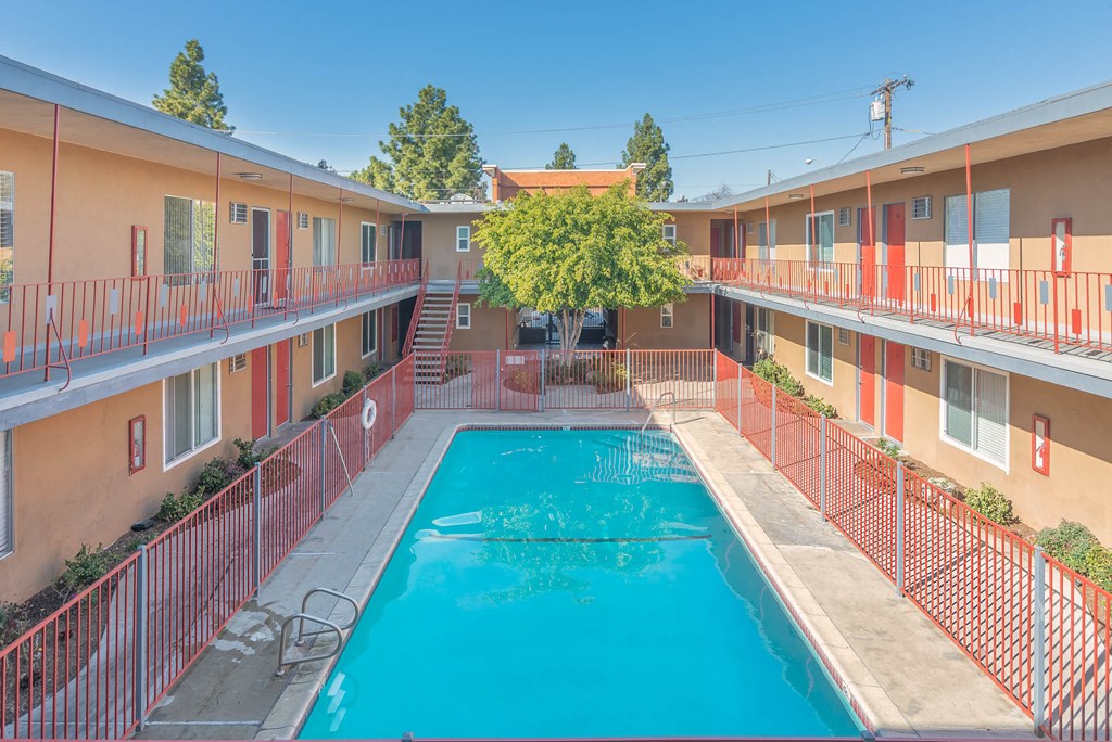a swimming pool in the middle of an apartment building