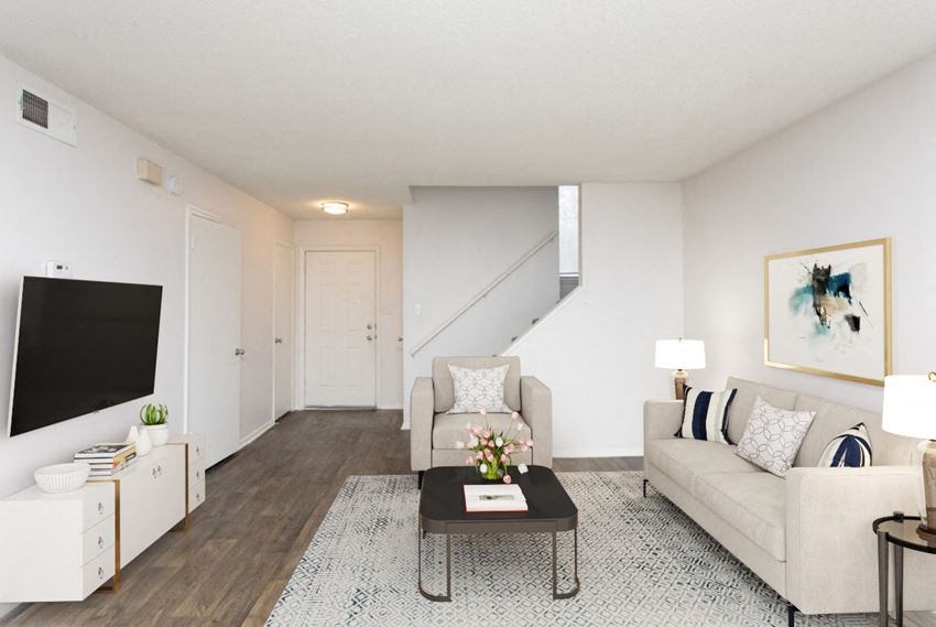 a living room with two couches a coffee table and a tv - Photo Gallery