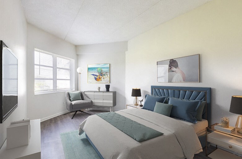 a bedroom with a bed and a chair in a room