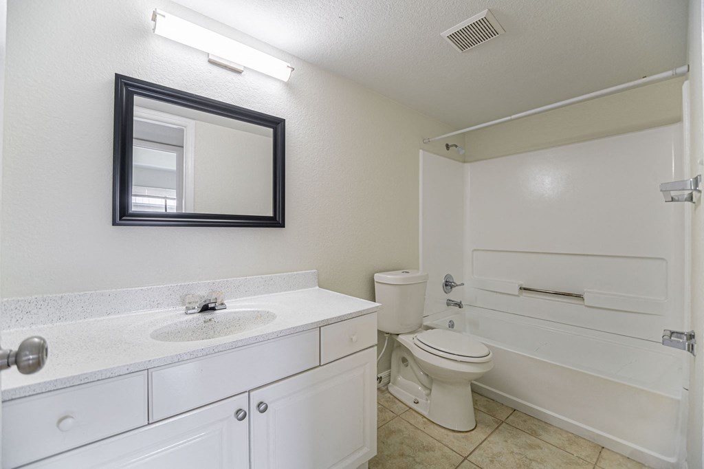 a bathroom with a sink toilet and bathtub