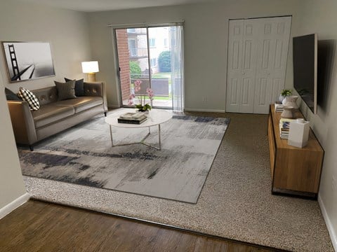 a living room with a couch and a coffee table and a rug