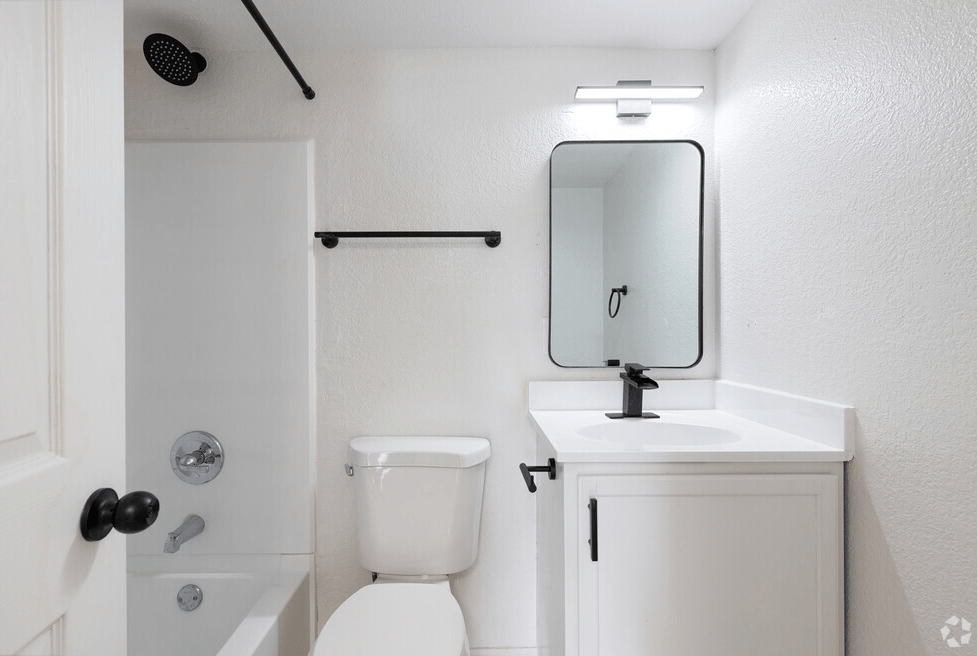 a bathroom with a sink toilet and bathtub