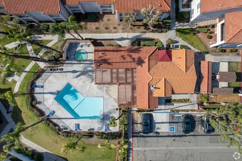 arial view of a house with a swimming pool in the yard