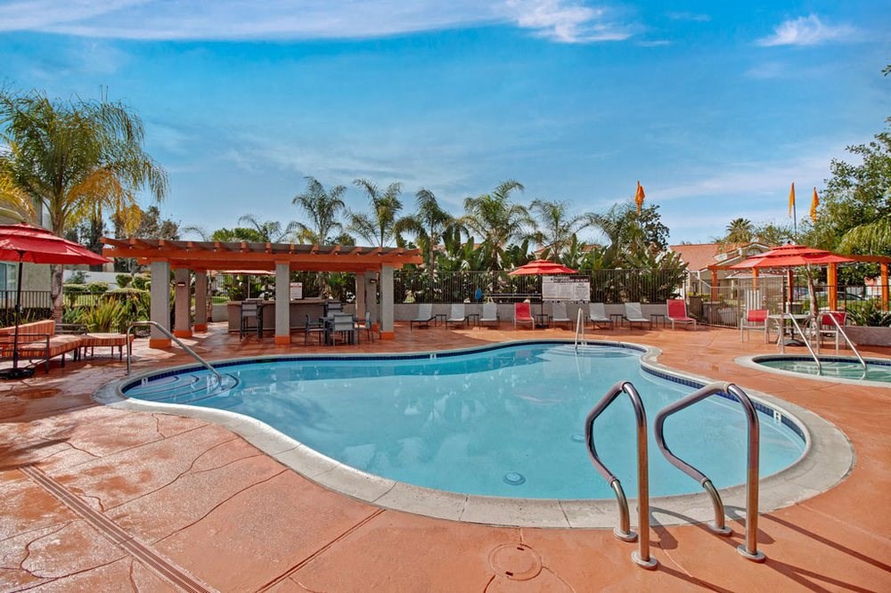 the swimming pool at the resort on a sunny day