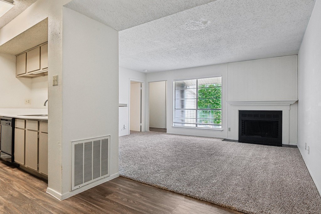 Carpeted Living Room at Abbey Glenn Apartments, Waco, Texas