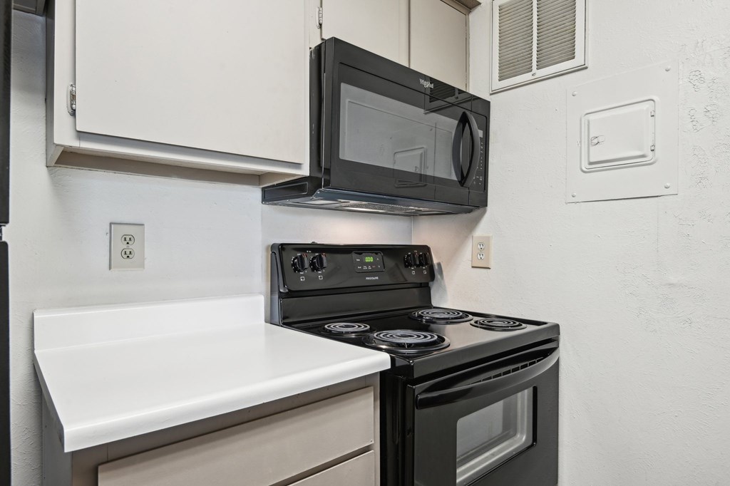 Updated Kitchen With Black Appliances at Abbey Glenn Apartments, Texas, 76706